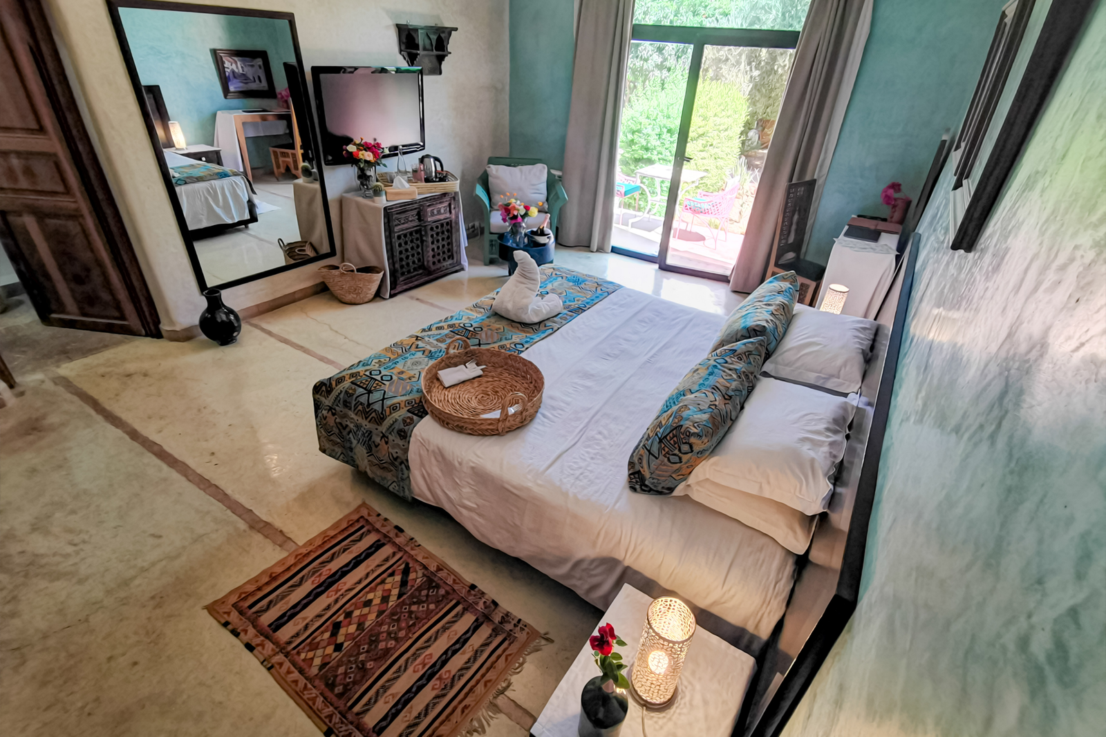 a bedroom with a large mirror and a bed